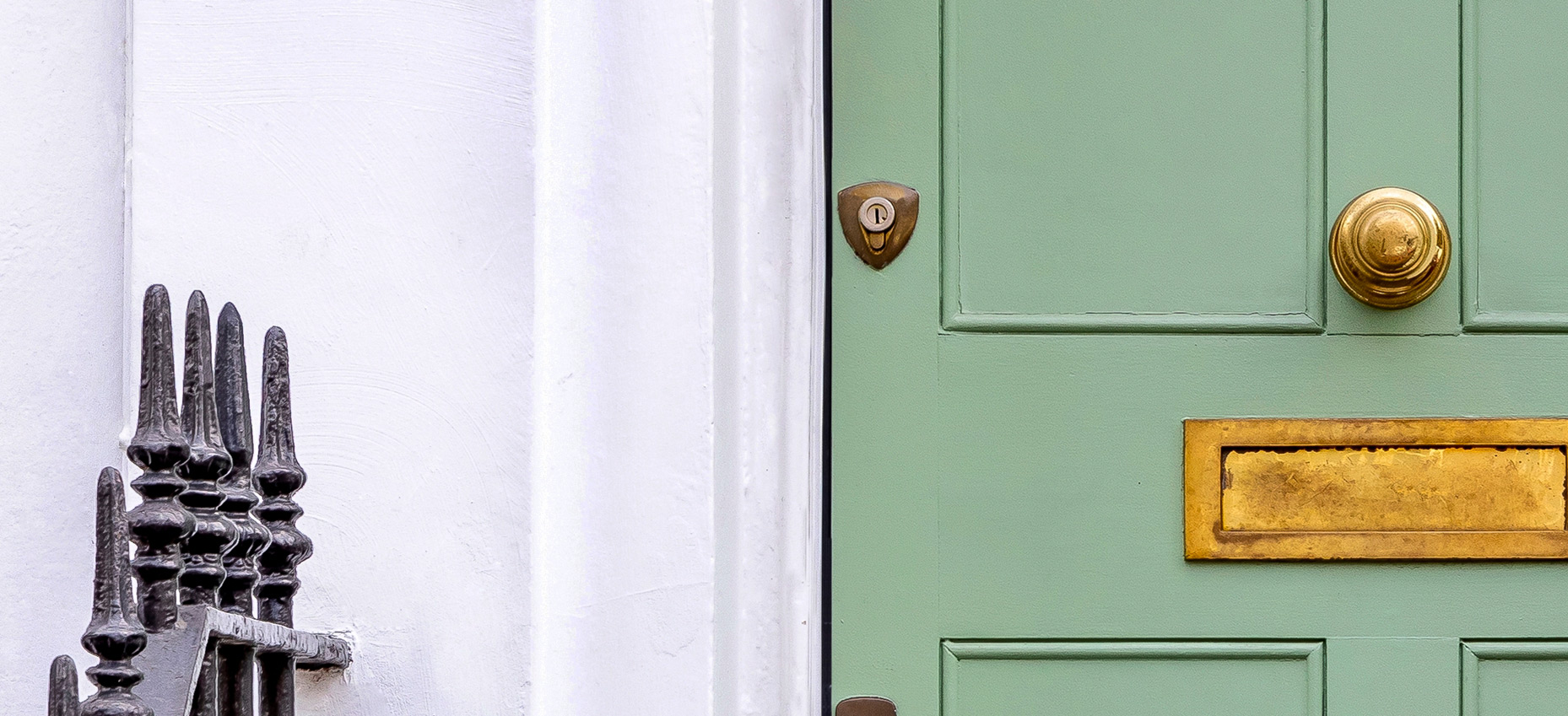 Green front door with brass fittings