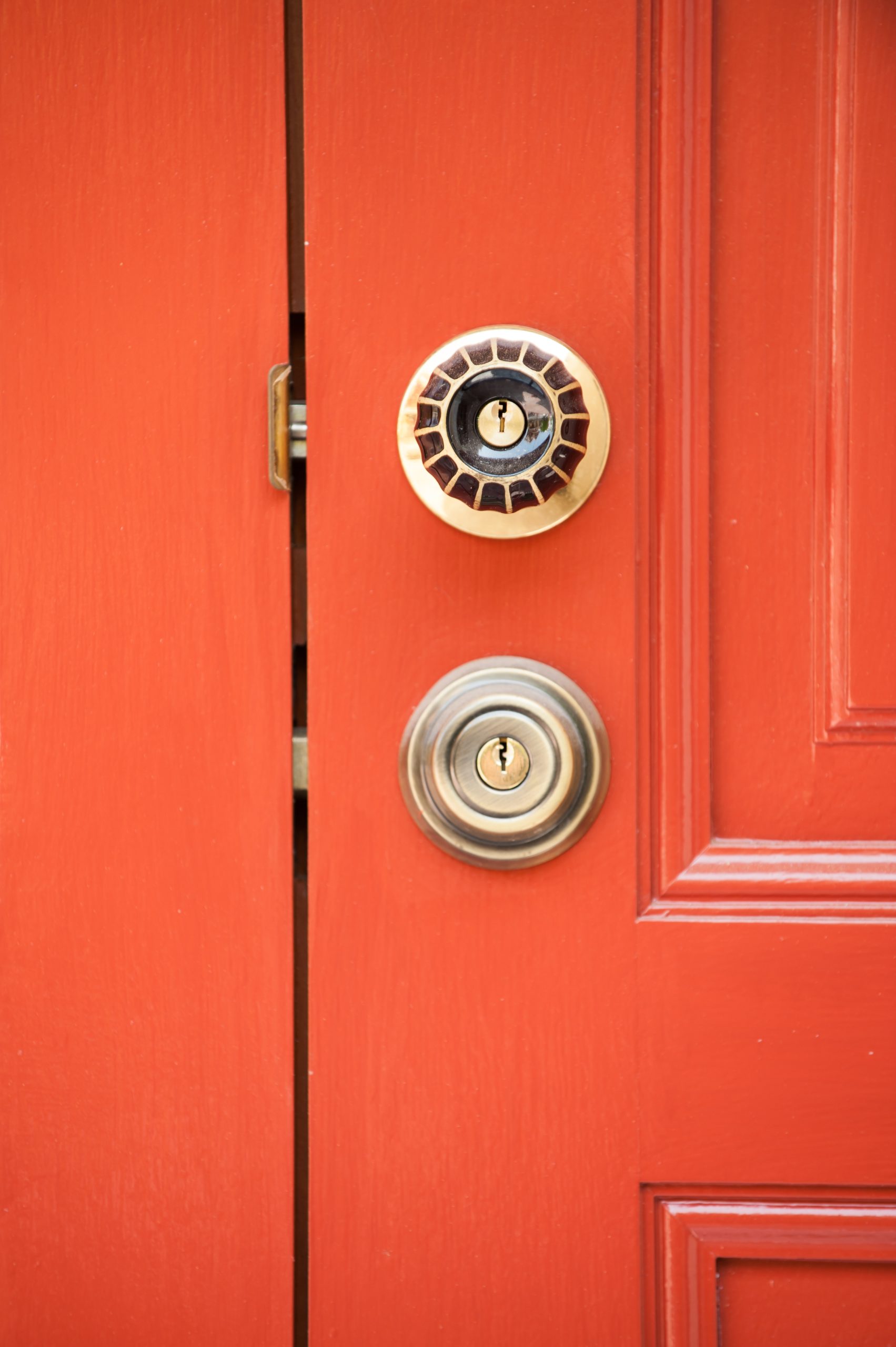 Red door with brass lock and handle