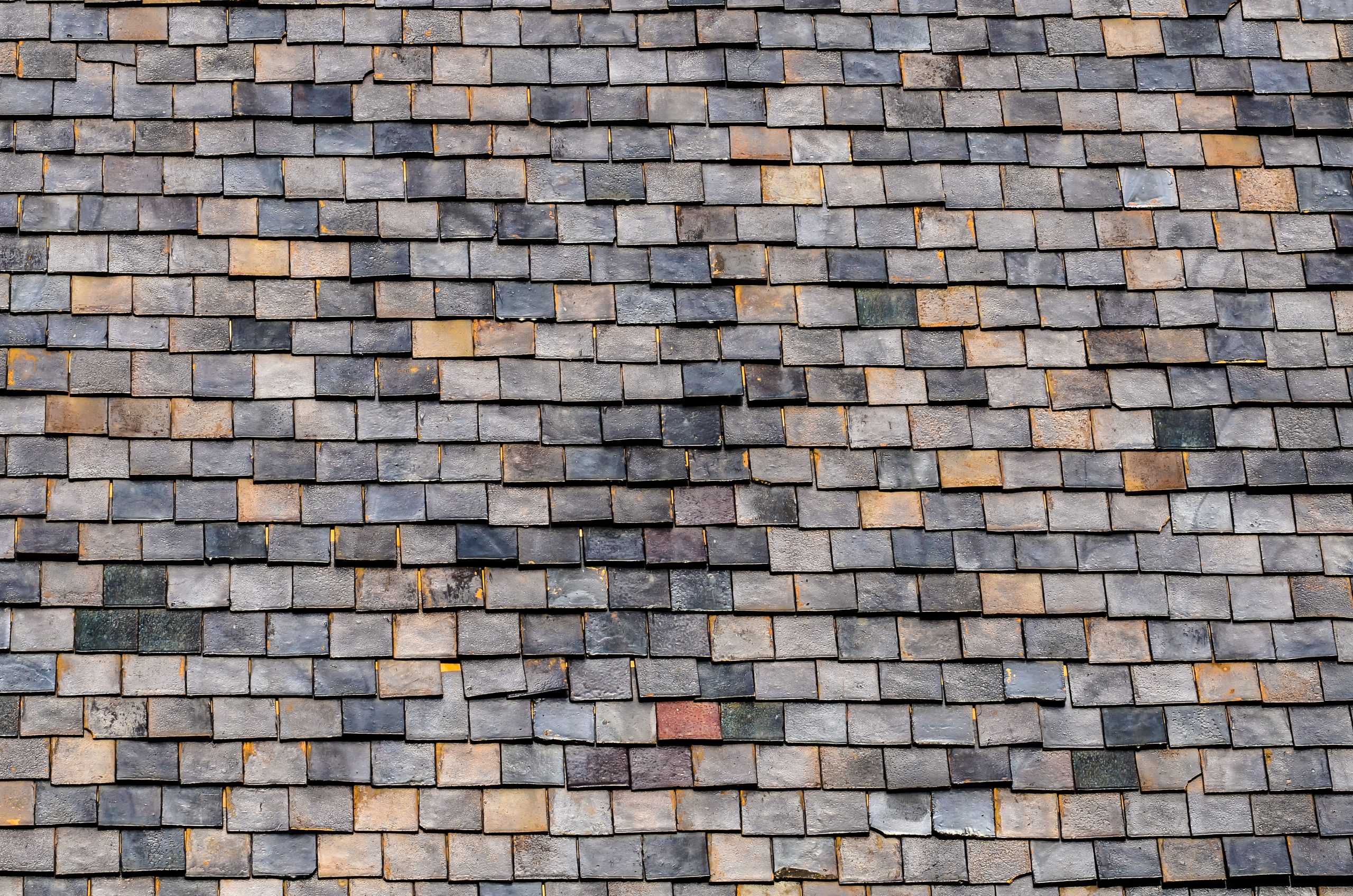Slate roof tiles in various tones